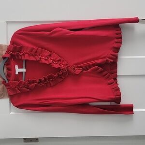 Sweater in Red with ruffle collar and base.